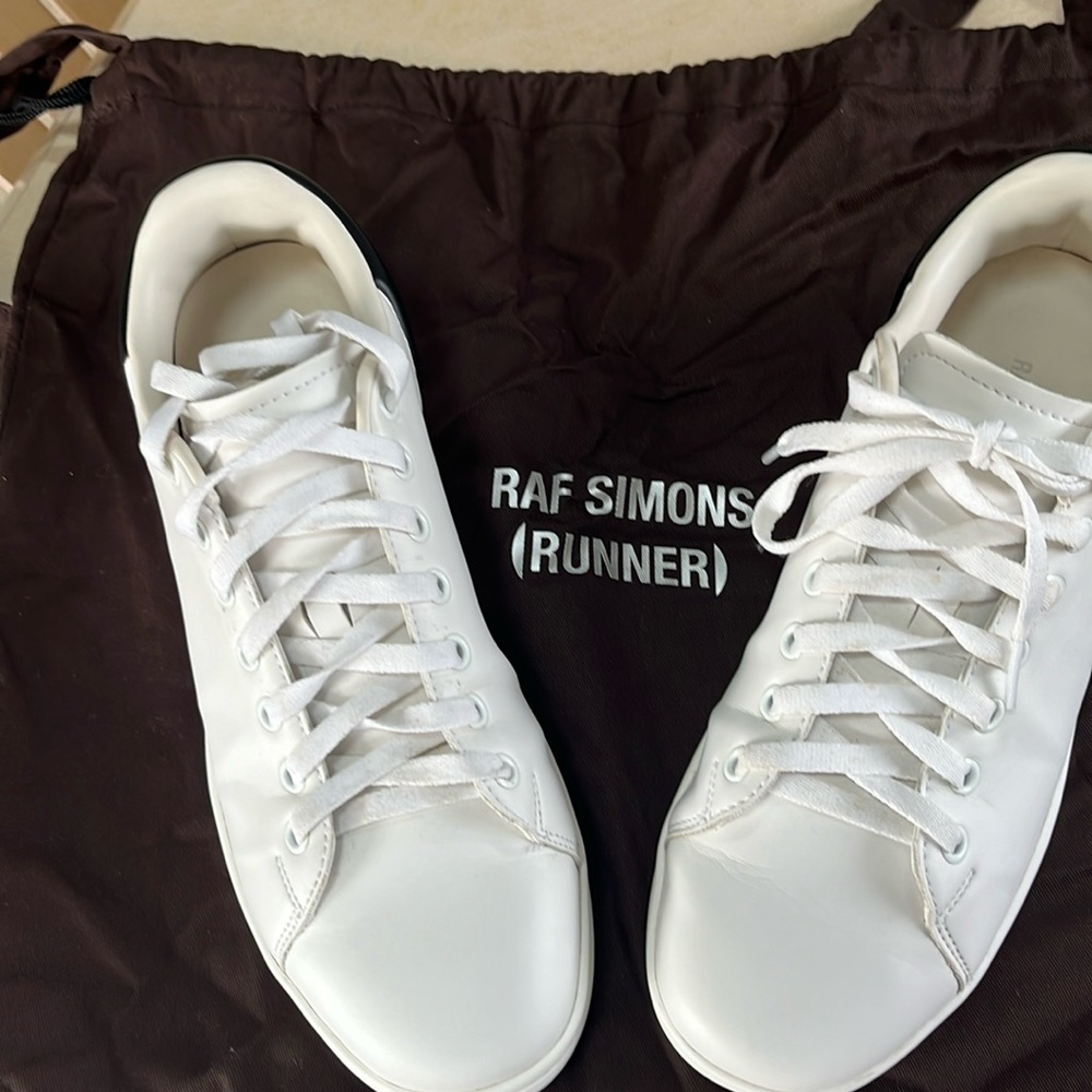 Men’s white worn outside  but clean sneakers by RAF Simons. EU size 41.